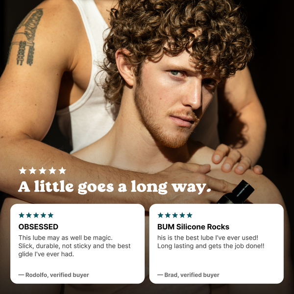 Couple embracing with a bottle of BUM Silicone Lube and two five-star reviews: a little goes a long way